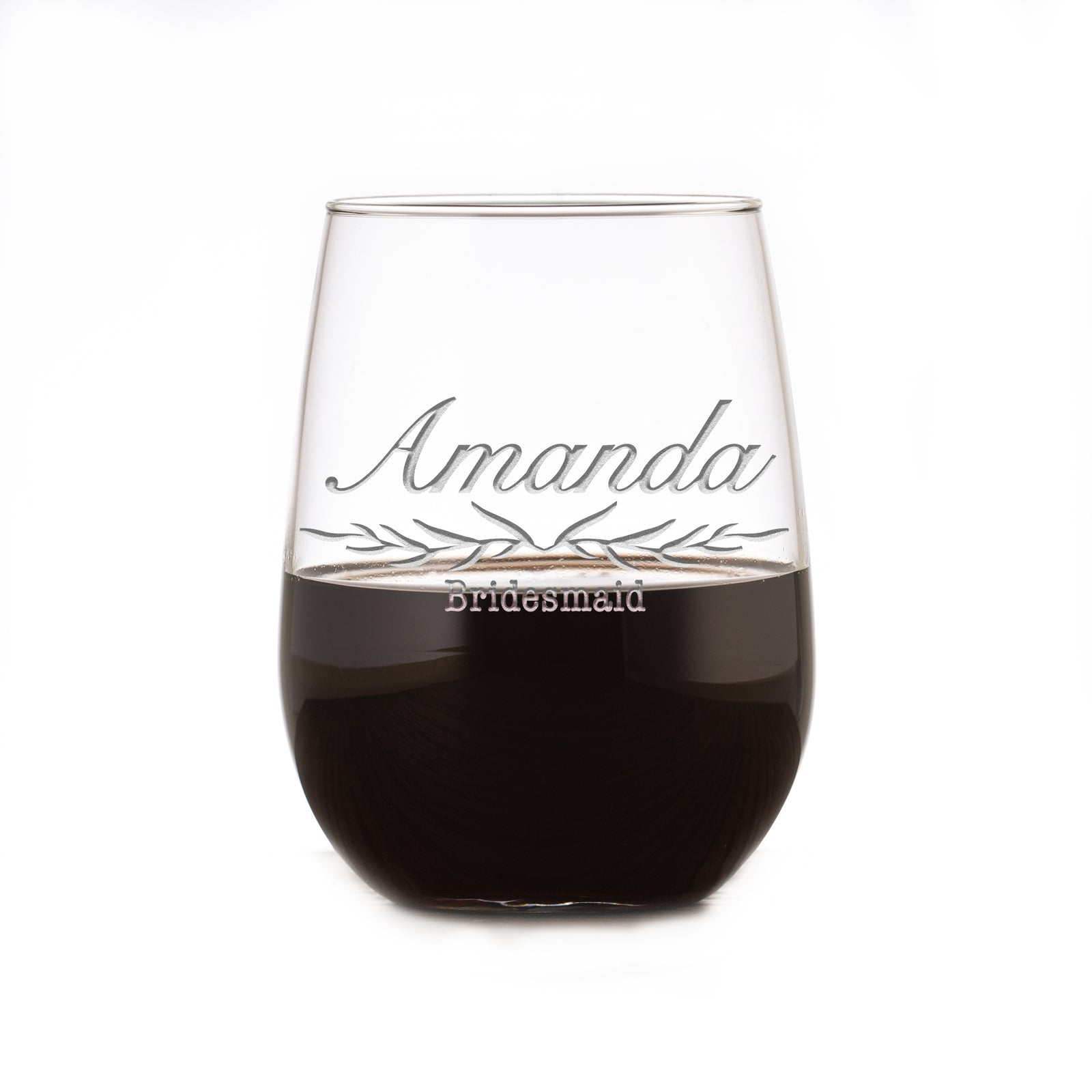Stemless wine glass filled with red wine, deep-etched with a banner reading "Amanda, Bridesmaid," on a white background.